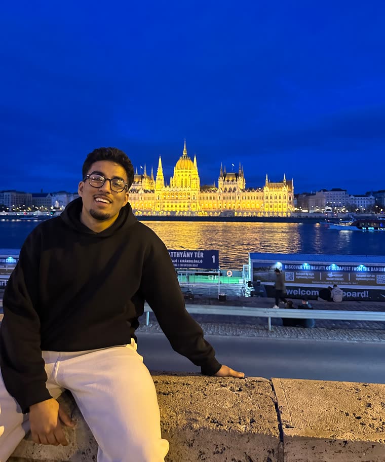 Aarham in Budapest, with the Parliament behind him